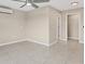 Bright bedroom featuring tile floors and a large closet at 76 Caddy Rd, Rotonda West, FL 33947