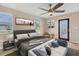 Main bedroom with large bed, access to backyard, and plenty of natural light at 76 Caddy Rd, Rotonda West, FL 33947