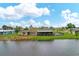 Single-Gathering home on the water with a screened-in pool at 76 Caddy Rd, Rotonda West, FL 33947