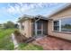 Screened patio with tiled flooring and landscaping at 76 Caddy Rd, Rotonda West, FL 33947