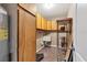 Laundry room with storage cabinets and utility sink at 76 Caddy Rd, Rotonda West, FL 33947