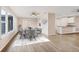Dining area with a modern dining table, neutral walls and wood flooring at 76 Caddy Rd, Rotonda West, FL 33947