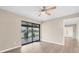Bedroom with water view and sliding glass doors to patio at 76 Caddy Rd, Rotonda West, FL 33947