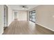 Spacious bedroom with light floors and access to another room at 76 Caddy Rd, Rotonda West, FL 33947