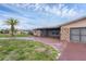 House exterior with stone accents and a red driveway at 76 Caddy Rd, Rotonda West, FL 33947
