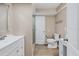 Updated bathroom with double vanity, shower, and tile floor at 76 Caddy Rd, Rotonda West, FL 33947