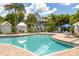 Resort-style pool with surrounding patio and lounge chairs at 13330 Anglers Way, Placida, FL 33946