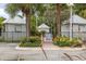 Inviting pool area with cabanas and lush landscaping at 13330 Anglers Way, Placida, FL 33946