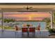 Spacious deck overlooking the water with sunset views, seating for four at 13330 Anglers Way, Placida, FL 33946