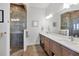 Spa-like bathroom with double vanity and large shower at 13330 Anglers Way, Placida, FL 33946