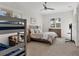 Main bedroom with a bunk bed, dresser and TV mount at 13330 Anglers Way, Placida, FL 33946