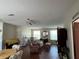 Spacious living room featuring hardwood floors, ample natural light, and comfortable furniture at 8485 Nighthawk Dr, Englewood, FL 34224