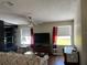 Living room with window and workspace at 8485 Nighthawk Dr, Englewood, FL 34224