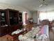 Living room with dark wood entertainment center at 8485 Nighthawk Dr, Englewood, FL 34224