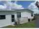 White mobile home with a partially visible fenced yard at 8485 Nighthawk Dr, Englewood, FL 34224