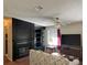 Living room with fireplace and flat-screen TV at 8485 Nighthawk Dr, Englewood, FL 34224