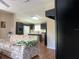 Open living room with view of kitchen at 8485 Nighthawk Dr, Englewood, FL 34224
