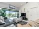 Living room with comfortable seating and access to a screened patio at 4260 Placida Rd # 9B, Englewood, FL 34224