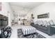 Bright living room with gray sofa and view of kitchen at 4260 Placida Rd # 9B, Englewood, FL 34224