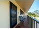 Private balcony with seating area, overlooking a lush green landscape at 4260 Placida Rd # 9B, Englewood, FL 34224