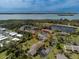 Aerial view of a condo building nestled in a tranquil community at 4260 Placida Rd # 9B, Englewood, FL 34224