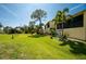 Landscaped backyard with lush lawn at 4260 Placida Rd # 9B, Englewood, FL 34224