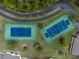 Two well-maintained tennis courts in a community setting at 4260 Placida Rd # 9B, Englewood, FL 34224