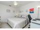 Comfortable bedroom with a king-size bed and a home office area at 4260 Placida Rd # 9B, Englewood, FL 34224