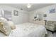 Spacious bedroom with a queen-size bed and an ensuite bathroom at 4260 Placida Rd # 9B, Englewood, FL 34224