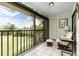 Peaceful screened balcony with view of tropical landscape at 4260 Placida Rd # 9B, Englewood, FL 34224