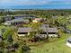 Aerial view of condo building in a lush, tropical setting at 4260 Placida Rd # 9B, Englewood, FL 34224
