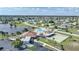 Aerial view of community amenities including pool and shuffleboard at 13478 Santa Rosa Ave, Port Charlotte, FL 33981