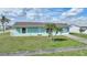 Single story home with green exterior at 13478 Santa Rosa Ave, Port Charlotte, FL 33981