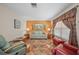 Bright living room with tiled floors, comfy seating, and coastal decor at 13478 Santa Rosa Ave, Port Charlotte, FL 33981