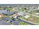 Aerial view of community pool, clubhouse, and tennis courts at 13478 Santa Rosa Ave, Port Charlotte, FL 33981