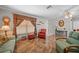 Living room featuring tiled floors, comfortable seating, and large window at 13478 Santa Rosa Ave, Port Charlotte, FL 33981
