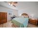 King-size bedroom with wood flooring and a built-in desk at 13478 Santa Rosa Ave, Port Charlotte, FL 33981