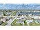 Aerial view of a single-Gathering home and surrounding neighborhood at 13478 Santa Rosa Ave, Port Charlotte, FL 33981