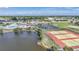 Aerial view showing tennis courts and pool area at 13478 Santa Rosa Ave, Port Charlotte, FL 33981