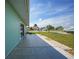 Large backyard patio with grassy area at 13478 Santa Rosa Ave, Port Charlotte, FL 33981