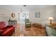 Spacious living area with tiled floors, comfortable seating, and views to dining area at 13478 Santa Rosa Ave, Port Charlotte, FL 33981