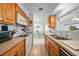 Kitchen boasts wood cabinets, ample counter space, and appliances at 13478 Santa Rosa Ave, Port Charlotte, FL 33981