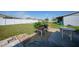 Landscaped backyard with patio and garden at 13478 Santa Rosa Ave, Port Charlotte, FL 33981