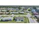 Aerial view of a single-Gathering home and surrounding neighborhood at 13478 Santa Rosa Ave, Port Charlotte, FL 33981
