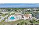 Community pool and clubhouse with surrounding neighborhood at 13478 Santa Rosa Ave, Port Charlotte, FL 33981