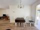 Cozy dining area with a drop-leaf table and four chairs at 13468 Romford Ave, Port Charlotte, FL 33981