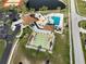 Aerial view of community pool, shuffleboard, and tennis courts at 13468 Romford Ave, Port Charlotte, FL 33981