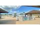 Community swimming pool with surrounding patio at 13468 Romford Ave, Port Charlotte, FL 33981