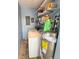 Small laundry room with washer, dryer, and shelving for storage at 13468 Romford Ave, Port Charlotte, FL 33981
