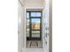 Screened entryway with tiled flooring and door at 6796 Gasparilla Pines Blvd # 95, Englewood, FL 34224